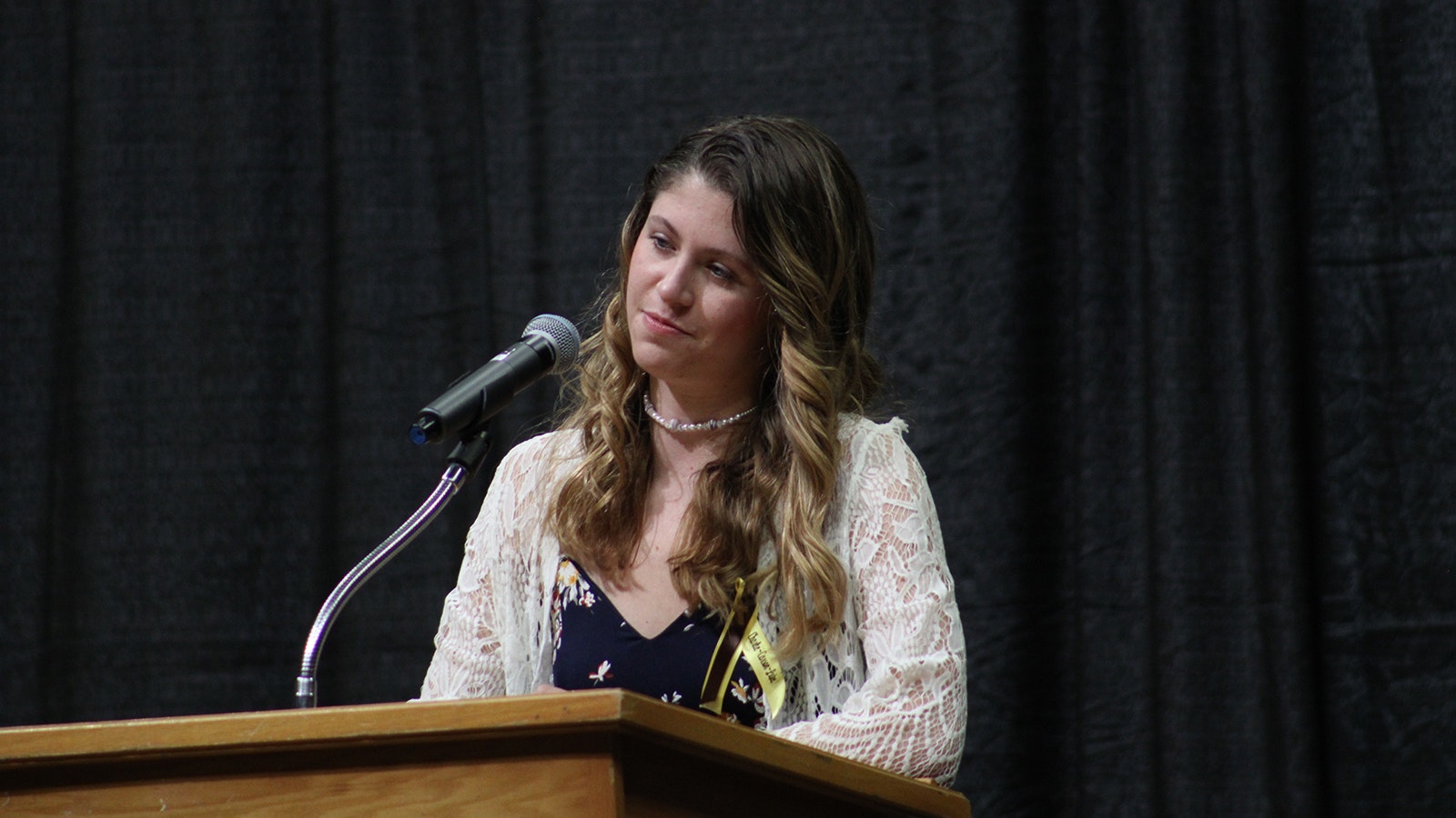 University of Wyoming women's swim team member Madeline Bane speaks during a Wednesday memorial service for there of her teammates who died in a car crash Feb. 22, 2024.