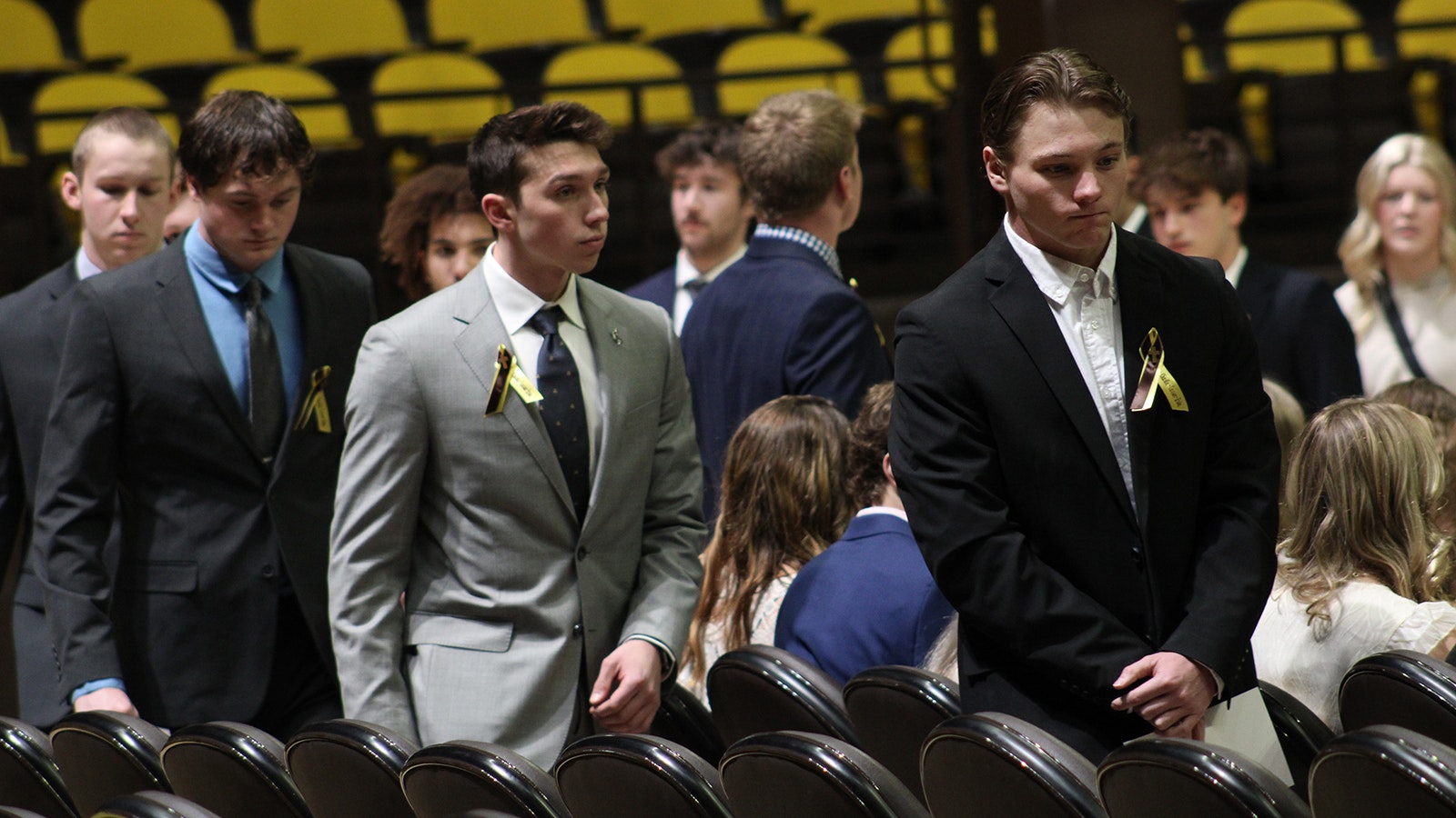 University of Wyoming student-athletes file into a memorial for three UW swimmers who lost their lives in a car crash Feb. 22, 2024.