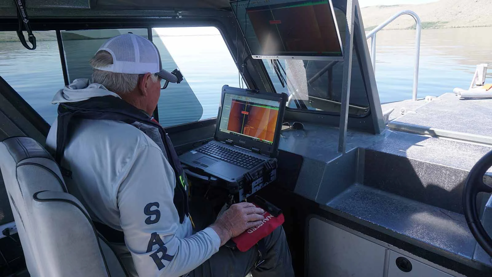 John Linn with Sublette County's Tip Top Search and Rescue helps search the depths of Fremont Lake for barrels triple-murderer Gerald Uden claims he dumped there containing the bodies of his 1980 victims.