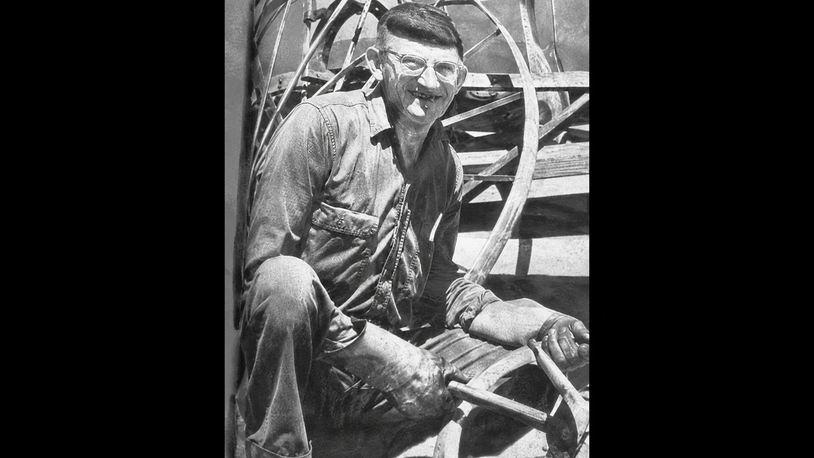 Reuben Reifschneider posed in his blacksmith work clothes at the request of Art Linkletter, the host of a popular CBS variety show. Reifschneider had won the title of Wyoming's Ugliest Man in 1964 and 1965 after traveling to Hollywood. While the other contestants wore outrageous costumes, Reifschneider remained himself. His "ugly" was the ability to pop out an eye and his teeth. 