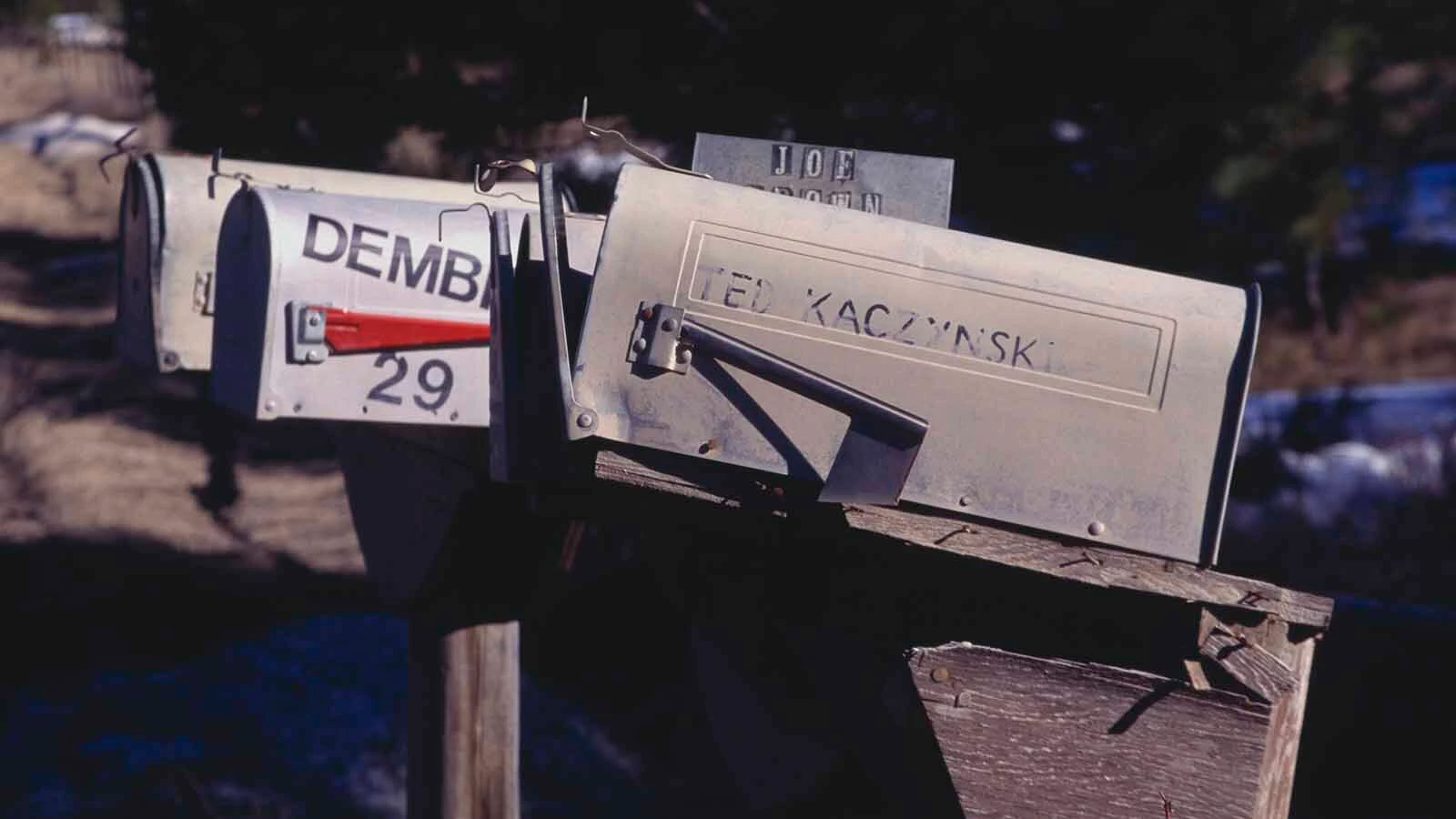View of a row of mailboxs, one bearing the name of Ted Kaczynski in faded lettering, in Lincoln, Montana, on April 4, 1996. Known as the Unabomber, Kaczynski was arrested and later pleaded guilty to mail bomb attacks that killed three people and injured 23.