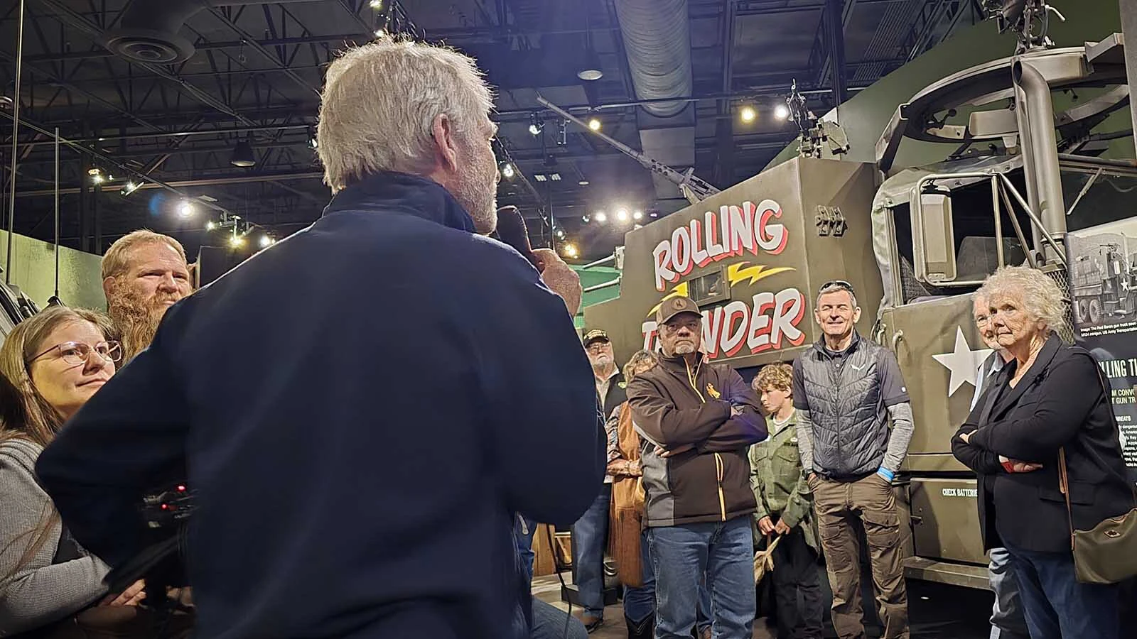 Dan Starks, owner of the National Museum of Military Vehicles, talks about how soldiers had to improvise during the Vietnam war to stay alive, turning ordinary cargo trucks into unauthorized gun trucks. In the background is an example of a gun truck in the National Museum of Military Vehicles. It's not a true to history replica, but its name may hark back to an aerial campaign of the same name.