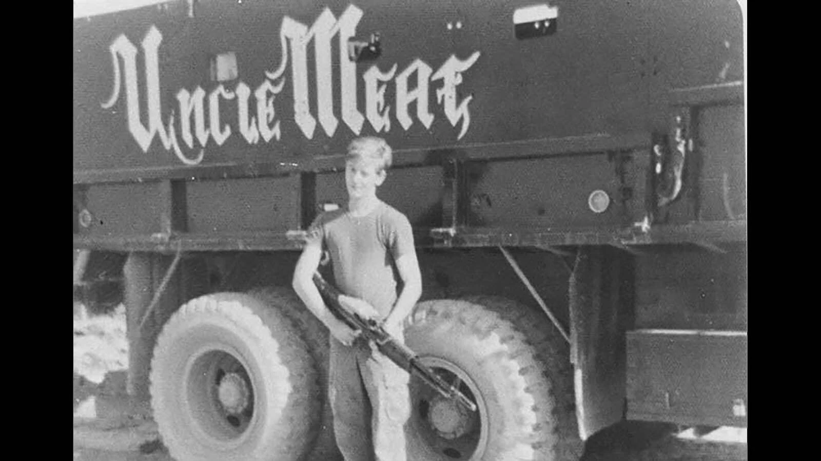 An unidentified member of the U.S. military circa 1968 with the "Uncle Meat" gun truck.