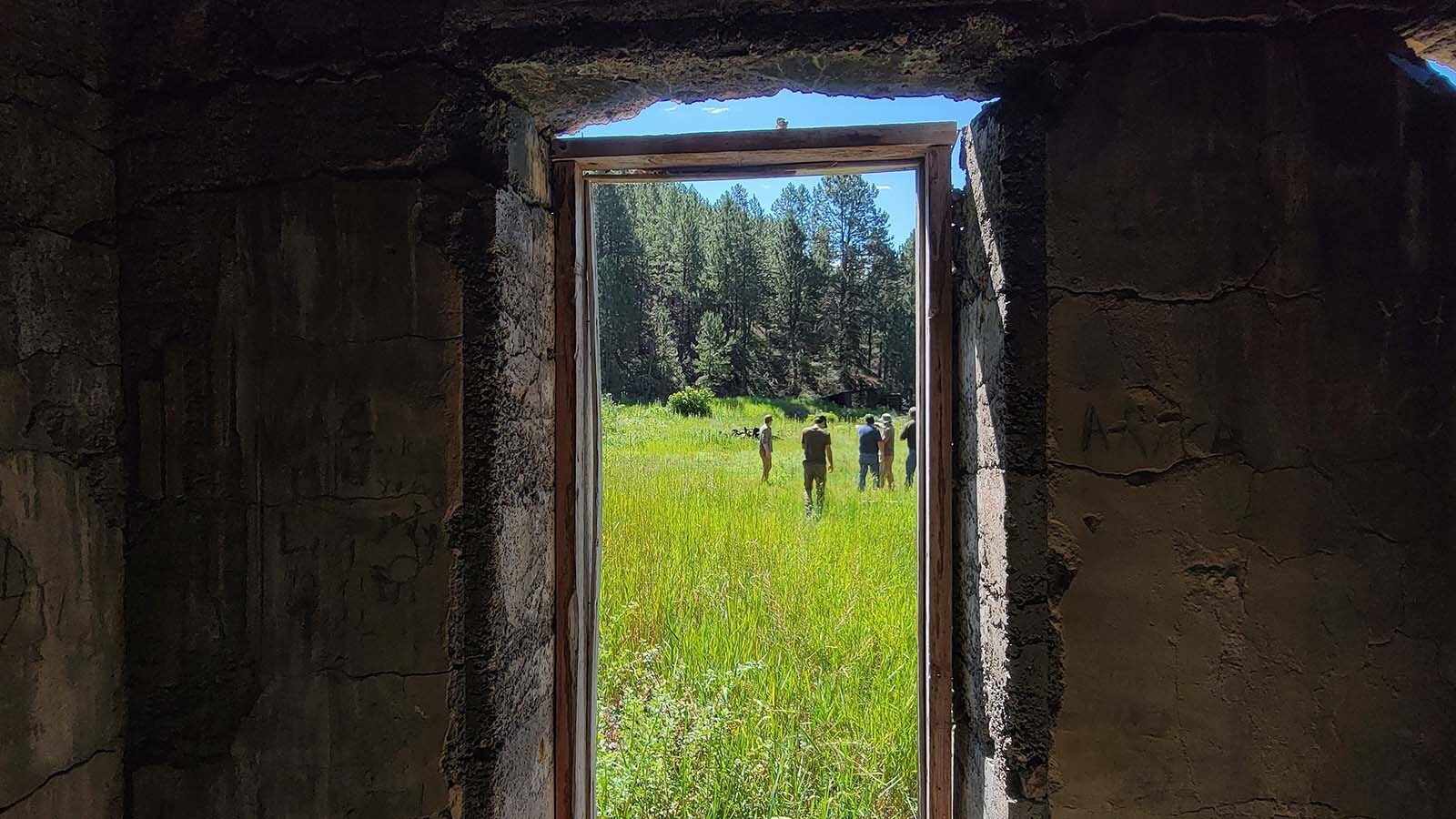 The History Under The Pines crew explored an old Wyoming mining ghost town and discovered the company safe. As part of their documentation efforts, they took a photo from the interior of the remains of the company safe that once sat at the center of the town.
