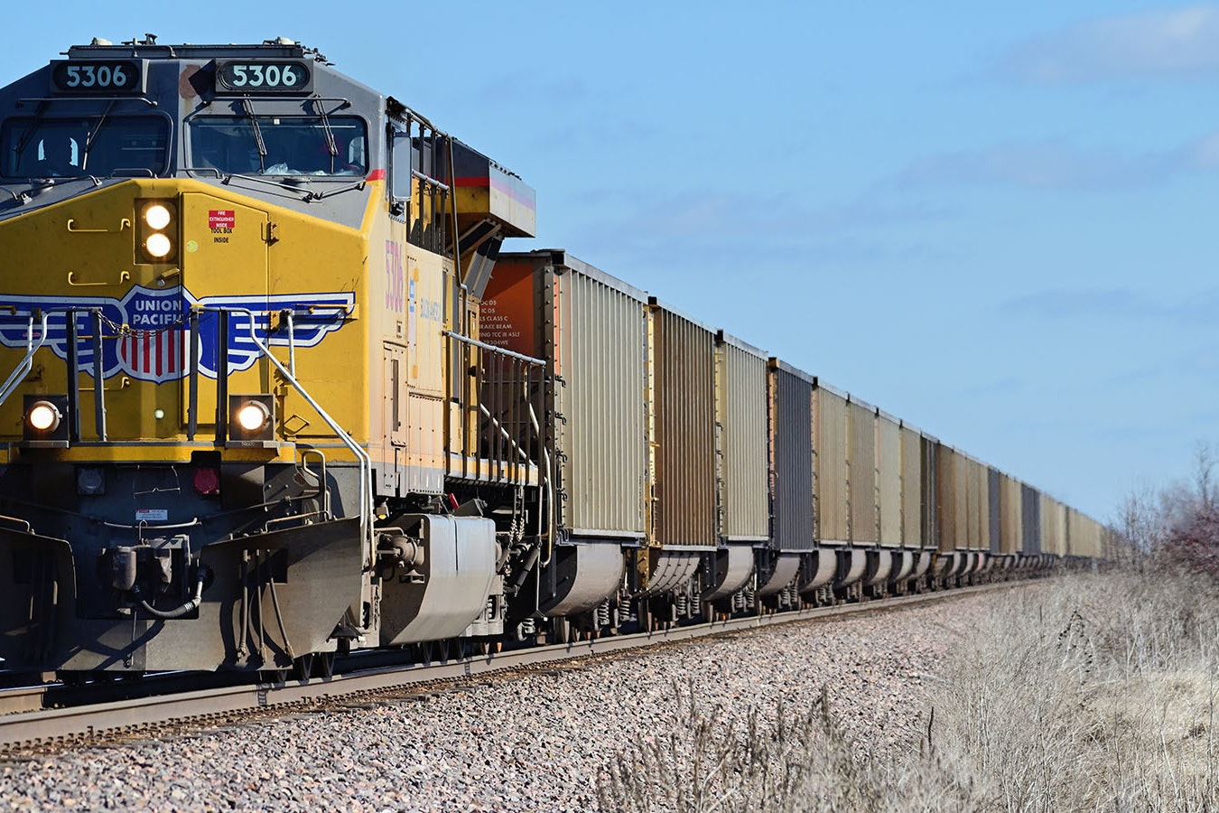 A Union Pacific locomotive pulls a string of empty cars through Wyoming's coal country.