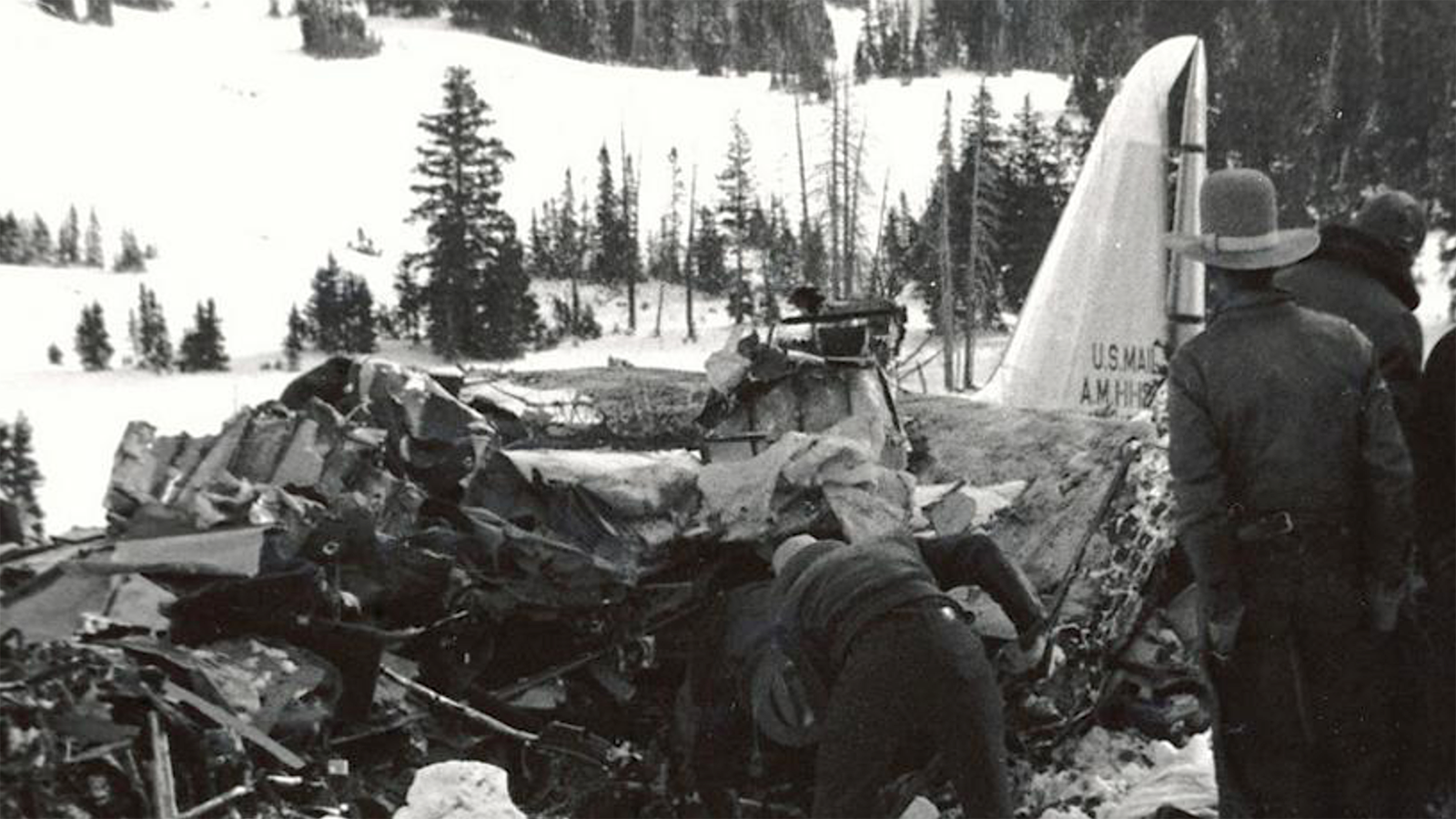 Officials at the scene of the DC3-A crash during recovery operations.