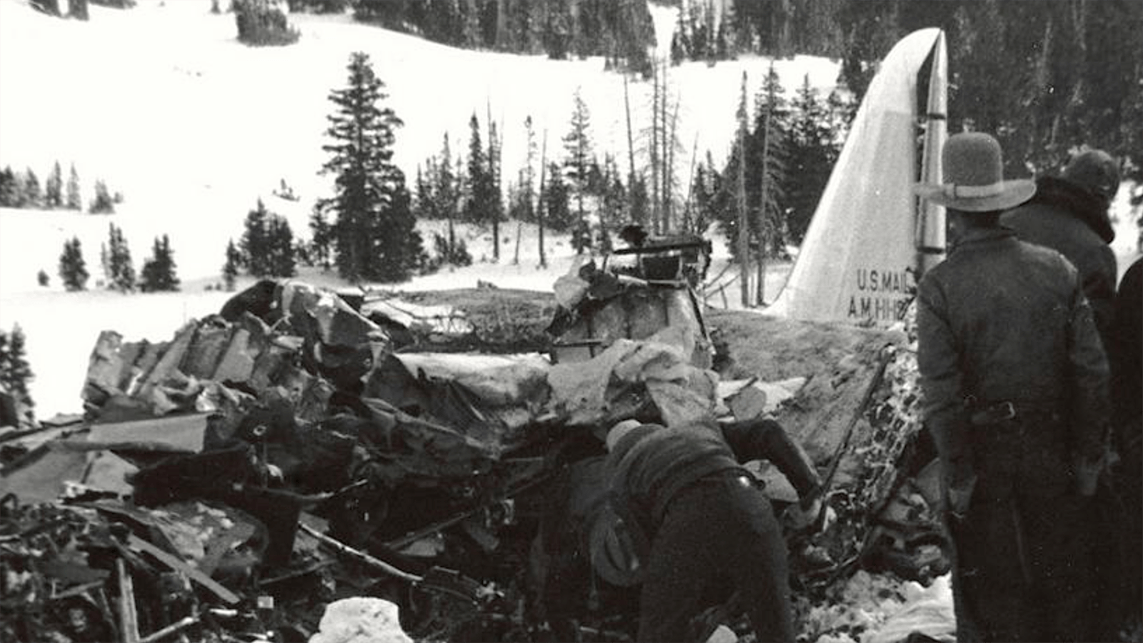 Officials at the scene of the DC3-A crash during recovery operations.