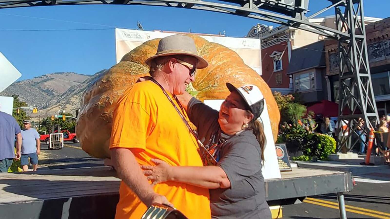 Ralph and Juana Laub celebrate their Utah record 2,289-pound pumpkin.