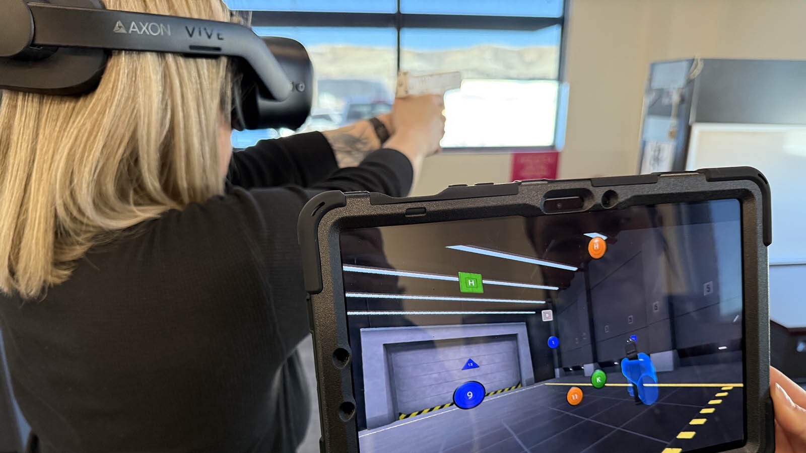 Detective Stephanie Cassidy runs through a virtual reality training program during a test of the technology at the Sweetwater County Sheriff's Office.