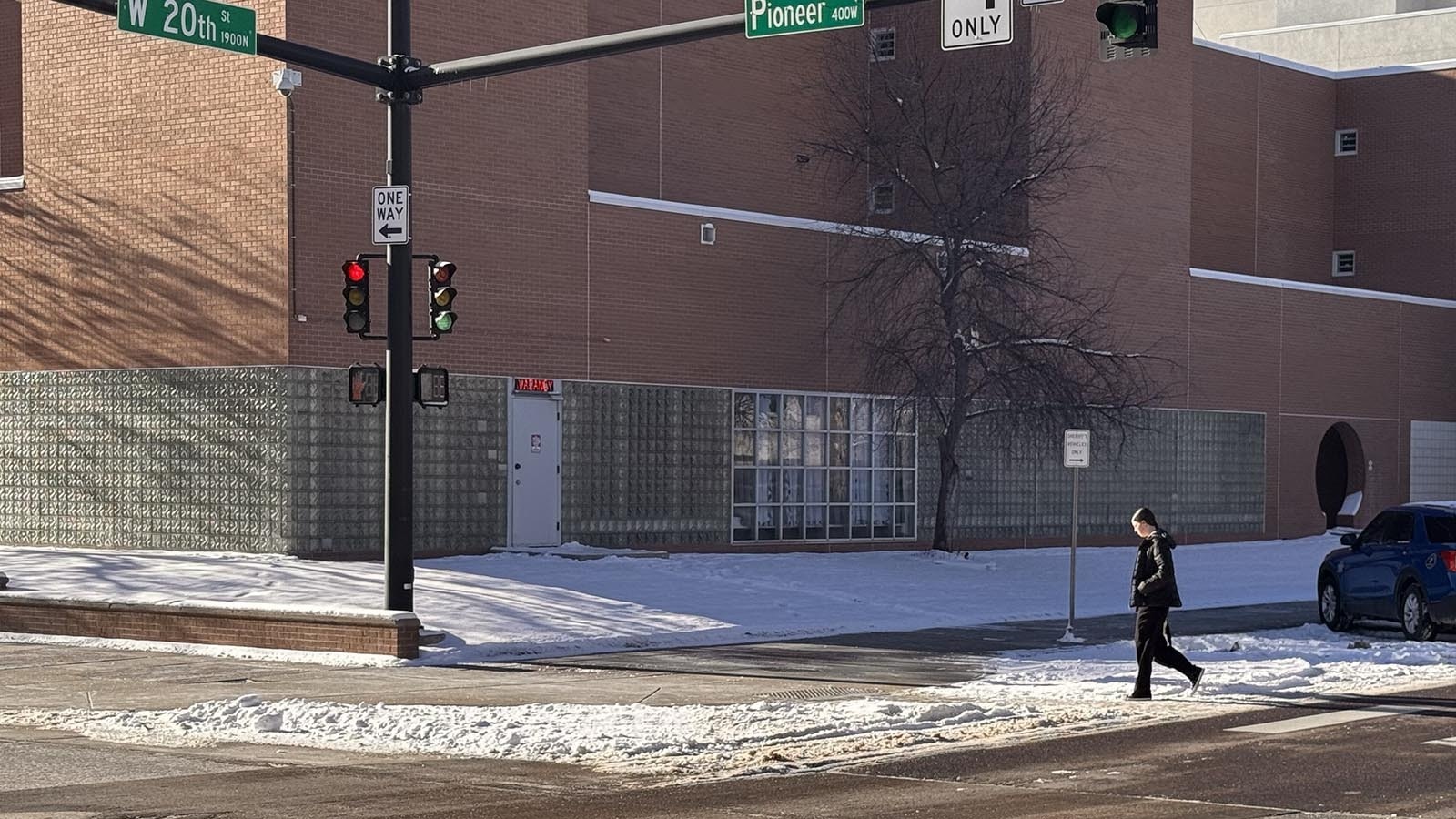 A motel-style "vacancy" sign flashes red over the north door of the Laramie County jail at the intersection of Pioneer Avenue and 20th Street in downtown Cheyenne.