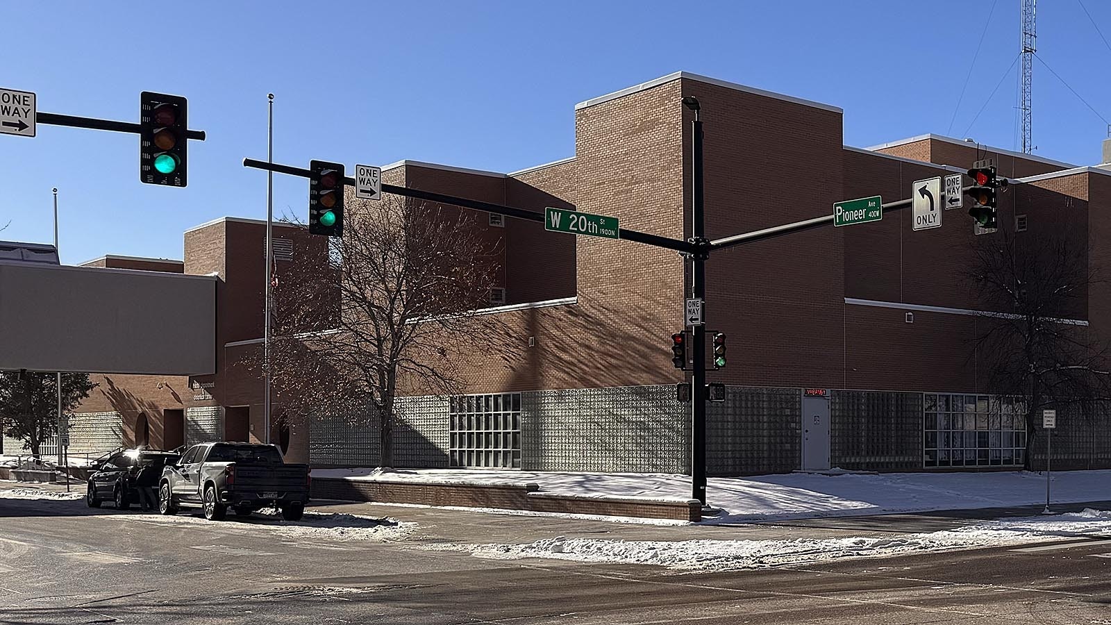 A motel-style "vacancy" sign flashes red over the north door of the Laramie County jail at the intersection of Pioneer Avenue and 20th Street in downtown Cheyenne.