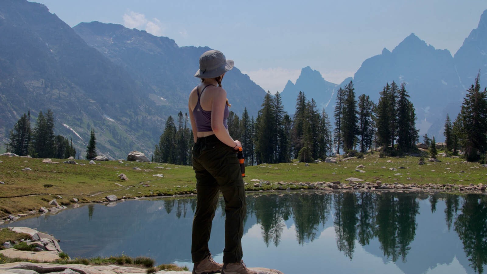 Sydnee Chapman takes a break at Lake Solitude while hiking in Cascade Canyon at Grand Teton National Park on July 16, 2024.