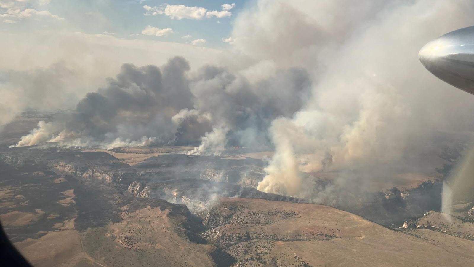 The Vees Fire burning in steep, rugged terrain about 13 miles southeast of Ten Sleep, Wyoming.