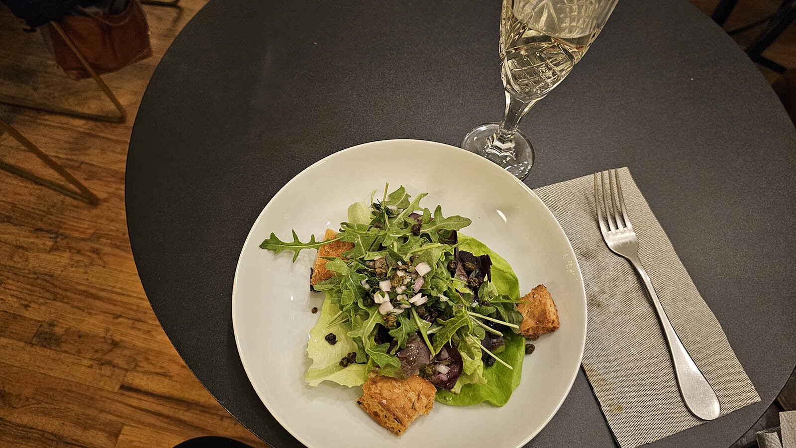 A perfect salad with bitter greens, tossed with foccacia croutons and a tart mignonette sauce. Served with a glass of Prosecco.