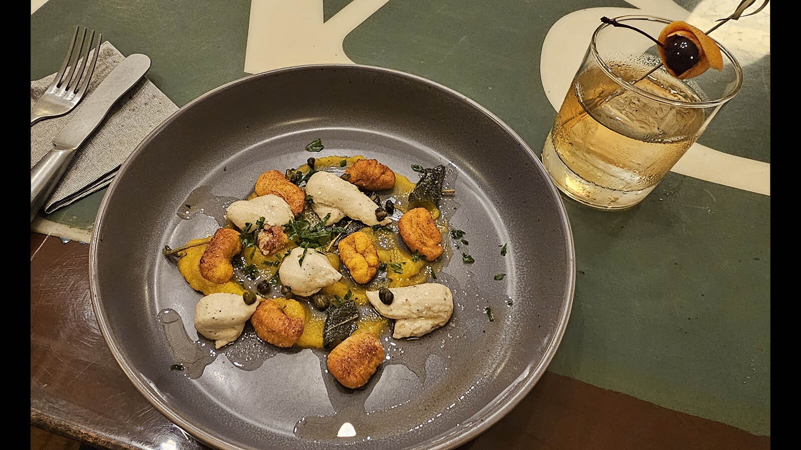 An artistic plate of gnocchi, with delicious cashew cream and butternut squash puree, drizzled with browned butter and dark green flecks of sage, accompanied with an old-fashioned cocktail. Despite having only vegetables, the dish was incredibly satisfying and filling.