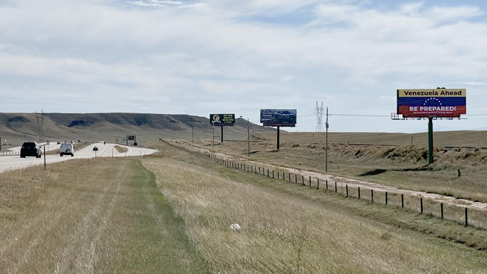 A large billboard designed like the Venezuelan flag warns drivers on southbound Interstate 25 as they enter Colorado that they're entering the South American country instead of the state.