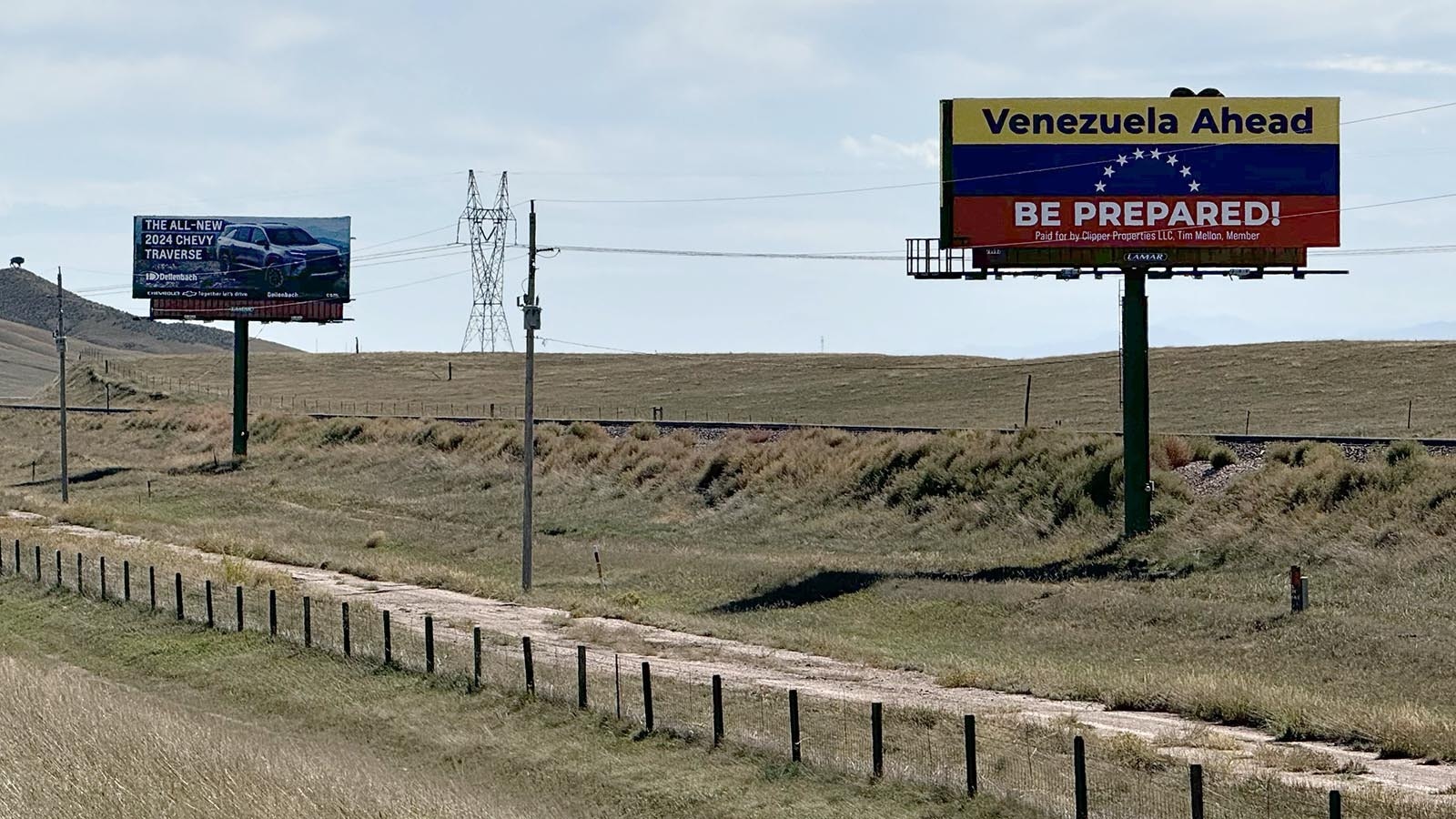 A large billboard designed like the Venezuelan flag warns drivers on southbound Interstate 25 as they enter Colorado that they're entering the South American country instead of the state.