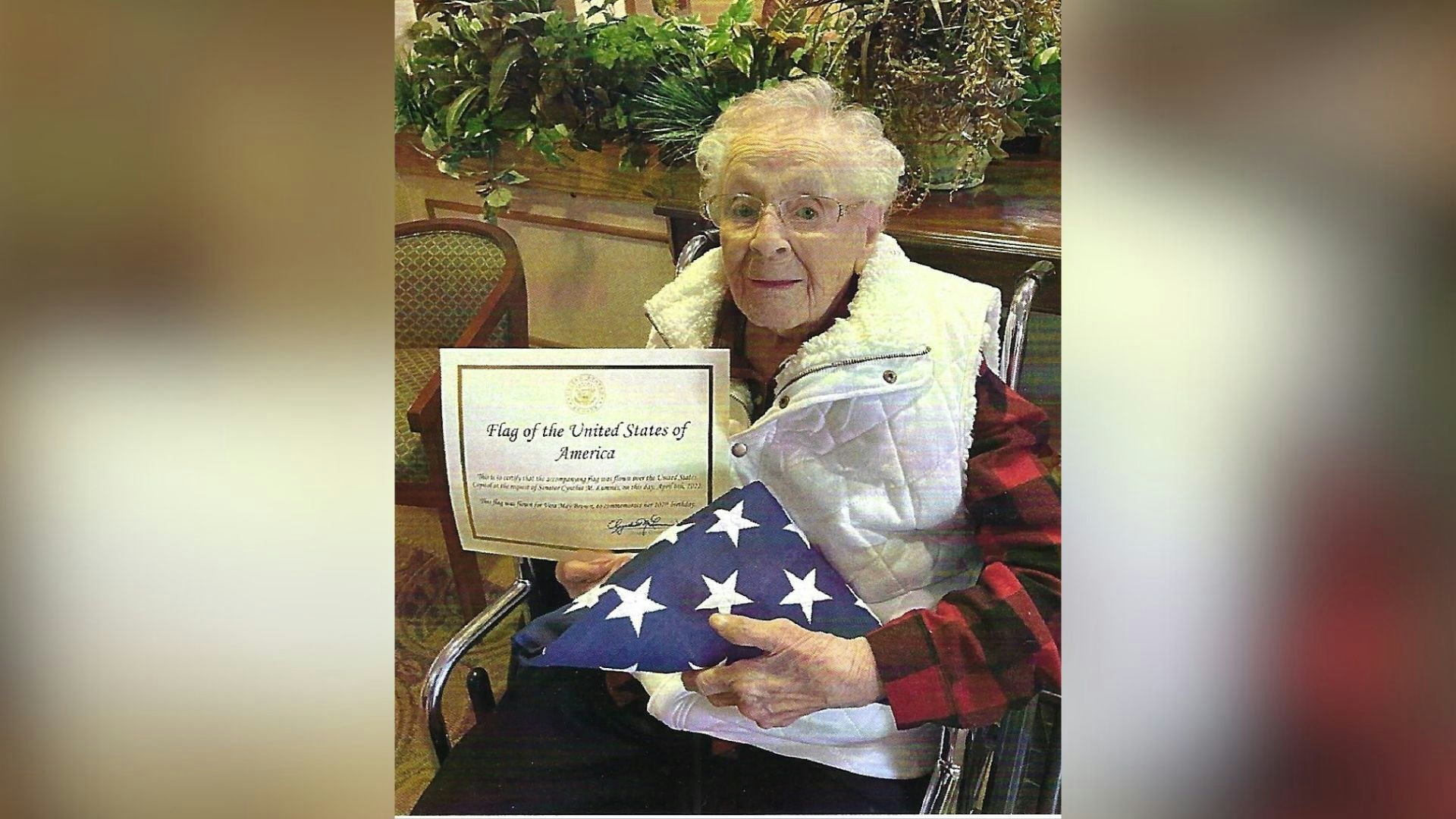Vera Brown of Gillette, who celebrated her 108th birthday last week, poses with an American flag that flew over the White House on her 107th birthday last year.