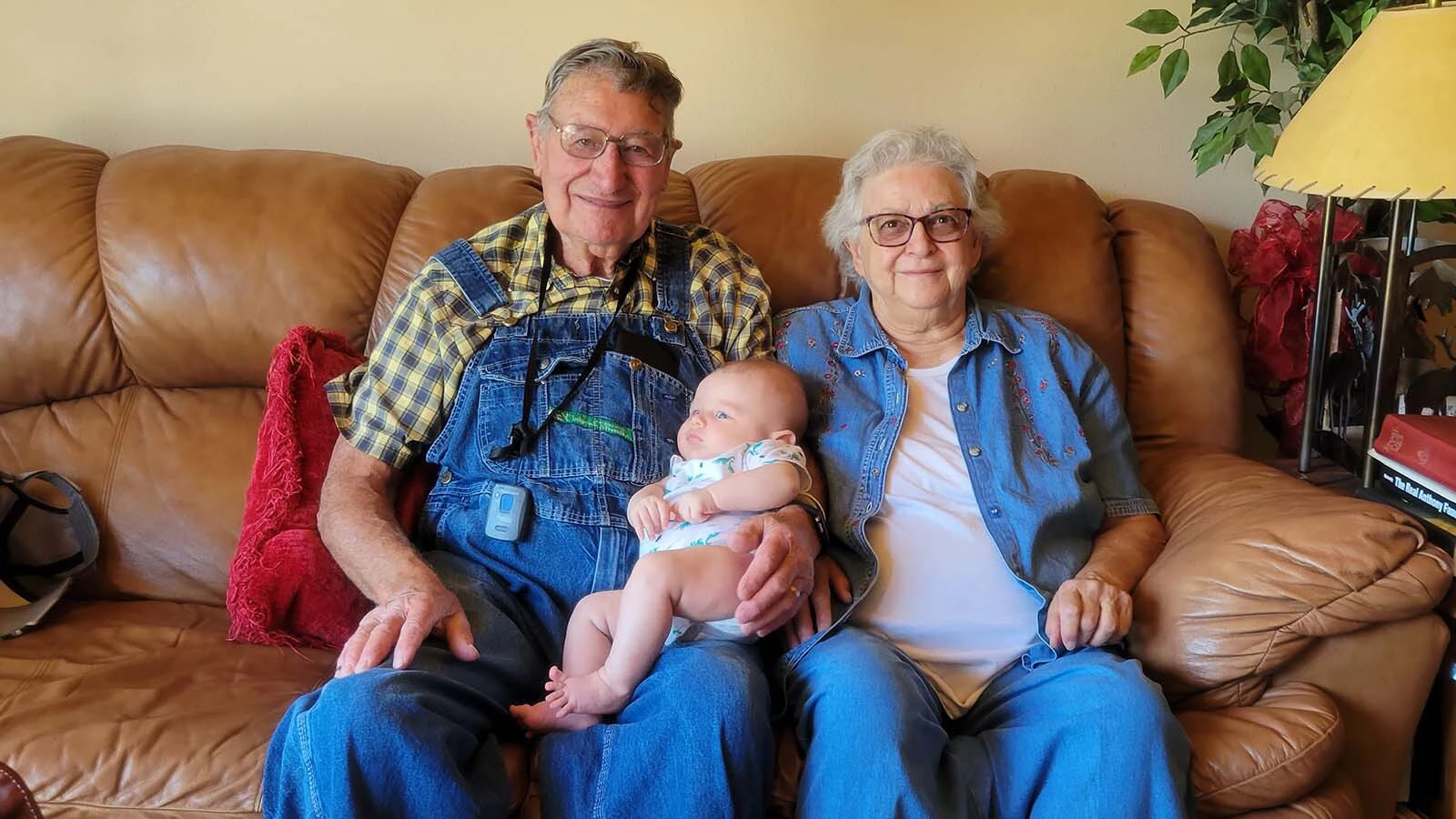 Vern Palmer and his wife Kay pose with a grandchild.