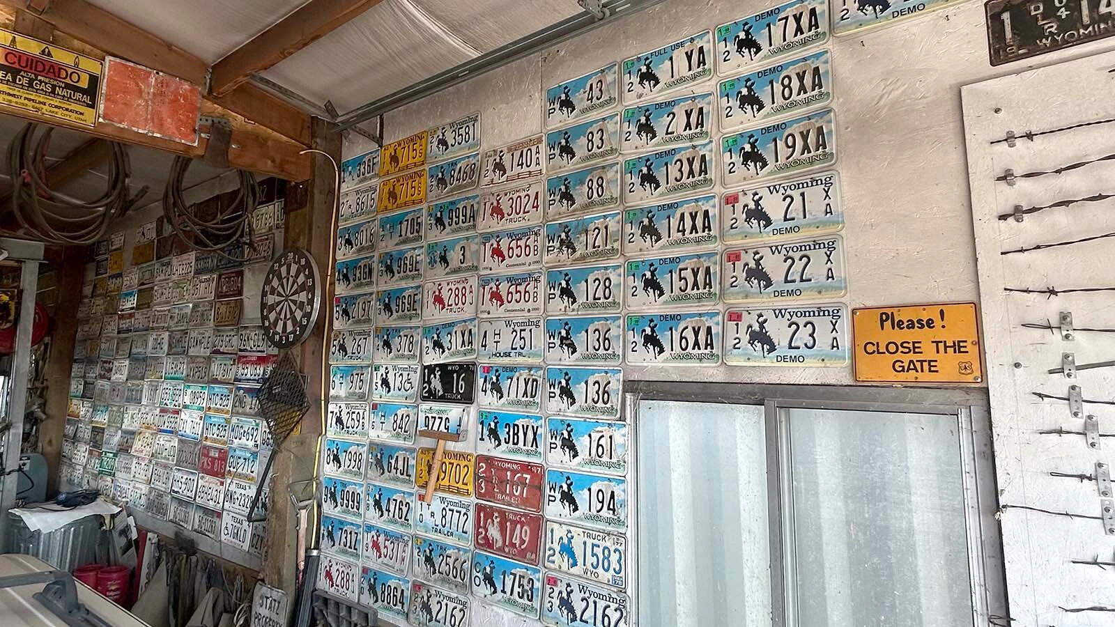 Rows of Wyoming license plates cover the walls of Vern Palmer's workshop in Big Piney. Palmer, 90, has spent nearly six decades rescuing the plates from abandoned dump grounds, old ranches and forgotten corners of Sublette County. 