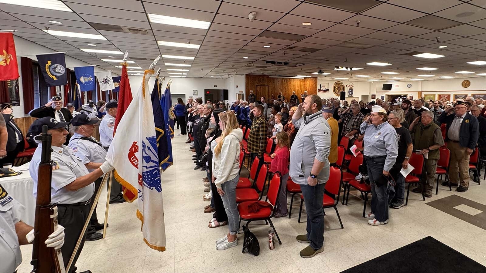 Flags of the various military branches are presented to attendees at Tuesday's Veterans Day ceremony at American Legion Post 6 in Cheyenne.