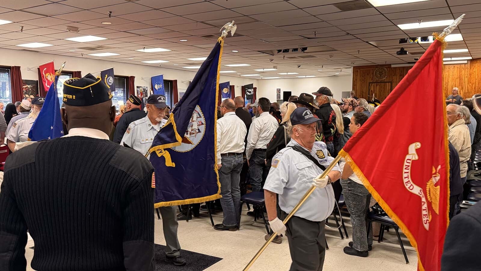 Flags of the various military branches are paraded past attendees at Tuesday's Veterans Day ceremony at American Legion Post 6 in Cheyenne.