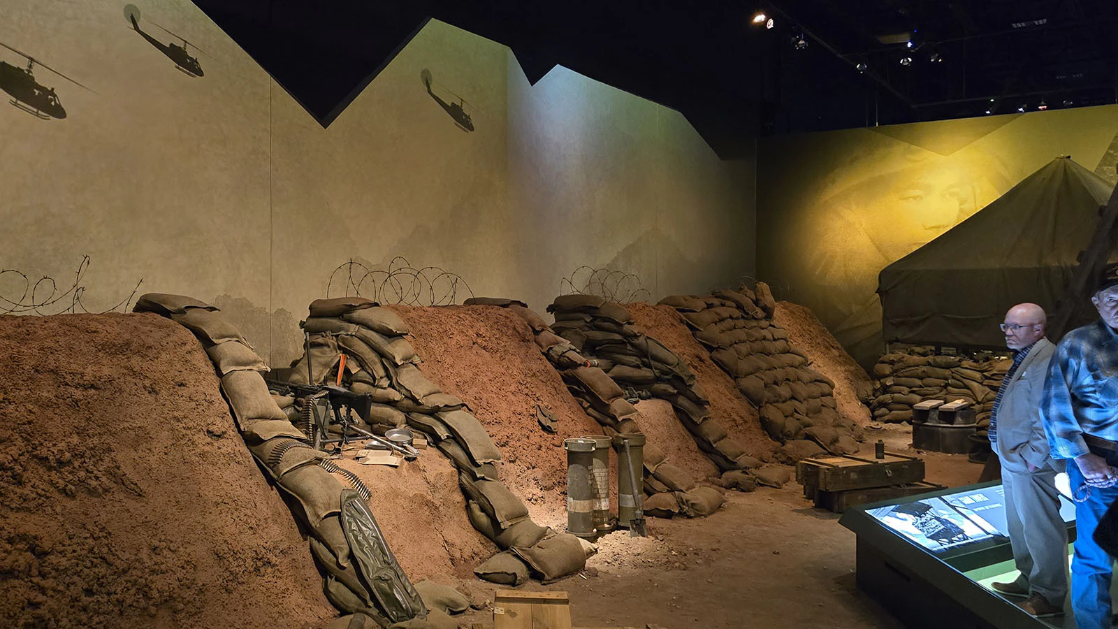 This simulation of a base in Vietnam includes a film that shows helicopters flying overhead and dropping explosives, which then go up in a cloud of smoke.