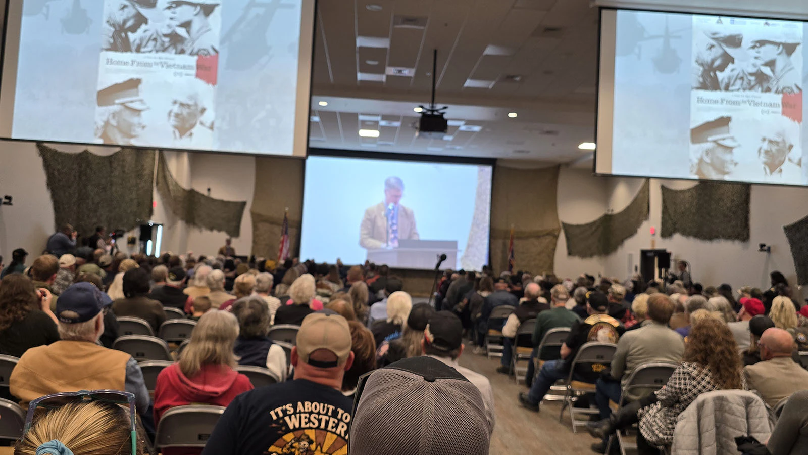Gov. Mark Gordon speaks to a full house at the Military Museum of National Vehicles during Wyoming's Welcome Home Day.