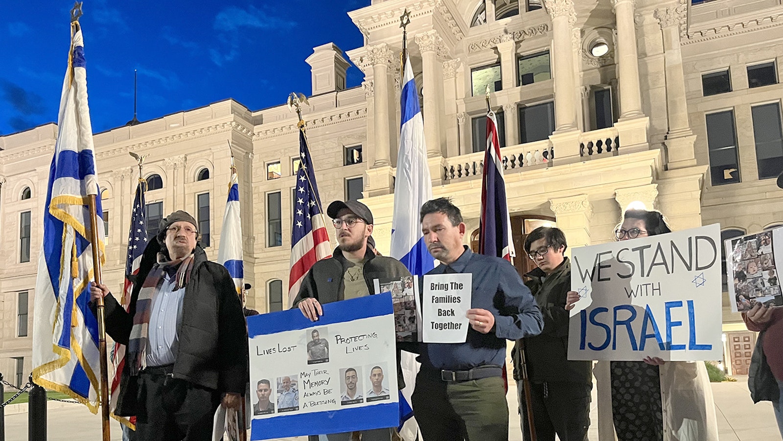 Rabbi Moshe Halfon, from left, Matani Ravenna and Noam Mantaka speak during Monday's peaceful vigil at the Wyoming Capitol in response to the Hamas attack on Israel.