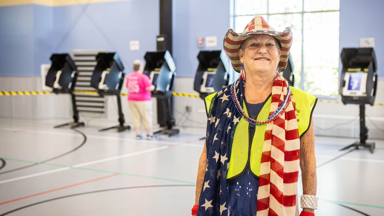 Nan Gilbert, a Laramie County election judge, waits for voters to arrive at the David R. Romero Park polling center. She's been an election judge for 20 years in Cheyenne.