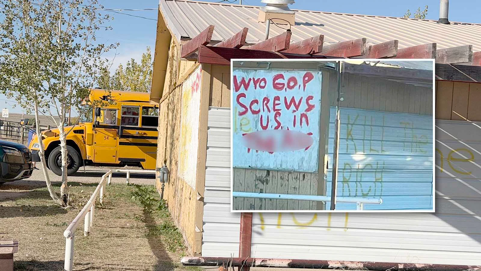 A school bus pulls alongside the old Lazy 8 east of Casper on Monday afternoon, where profane political messages have been painted across the former saloon.