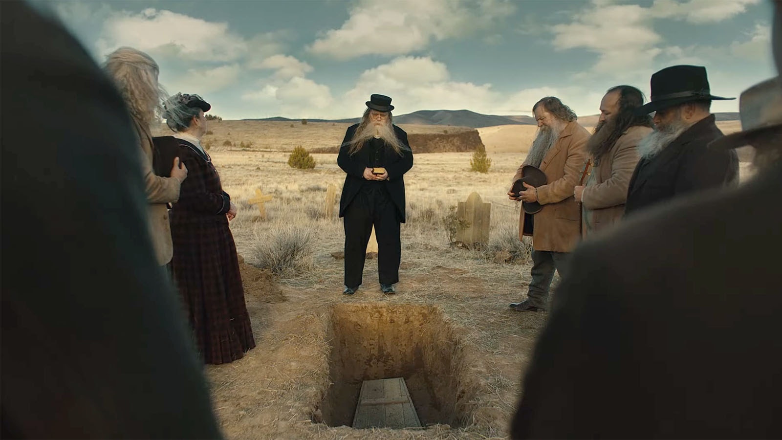 A column gathering in an Old-West setting of people mourning someone who died of shaving because he wasn't vaccinated for tetanus in a new ad by the Wyoming Department of Health.