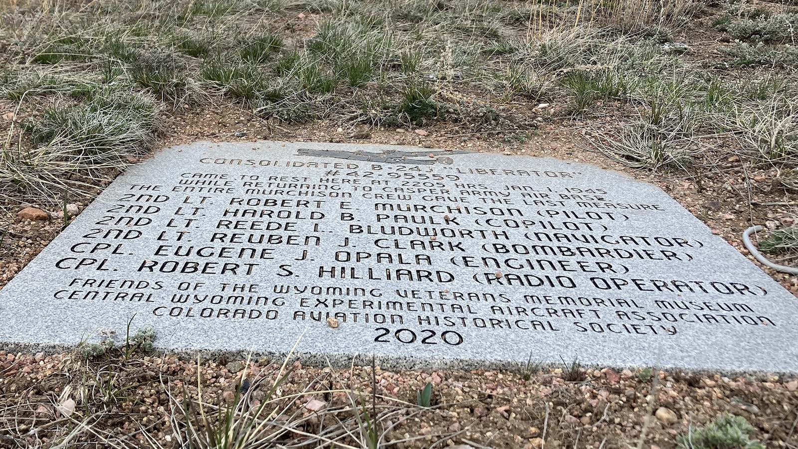 A plaque installed in 2021 on top of a knoll over looks the resting place of the B-24’s wrecked fuselage.