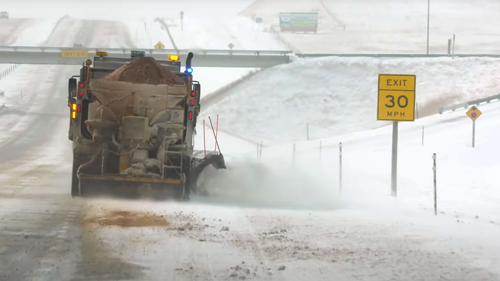 A Wyoming Department of Transportation sand and plow truck clears a highway in District 1, which includes much of Carbon County, including Saratoga, where a man is accused to shooting at sand trucks because of their loud brakes.
