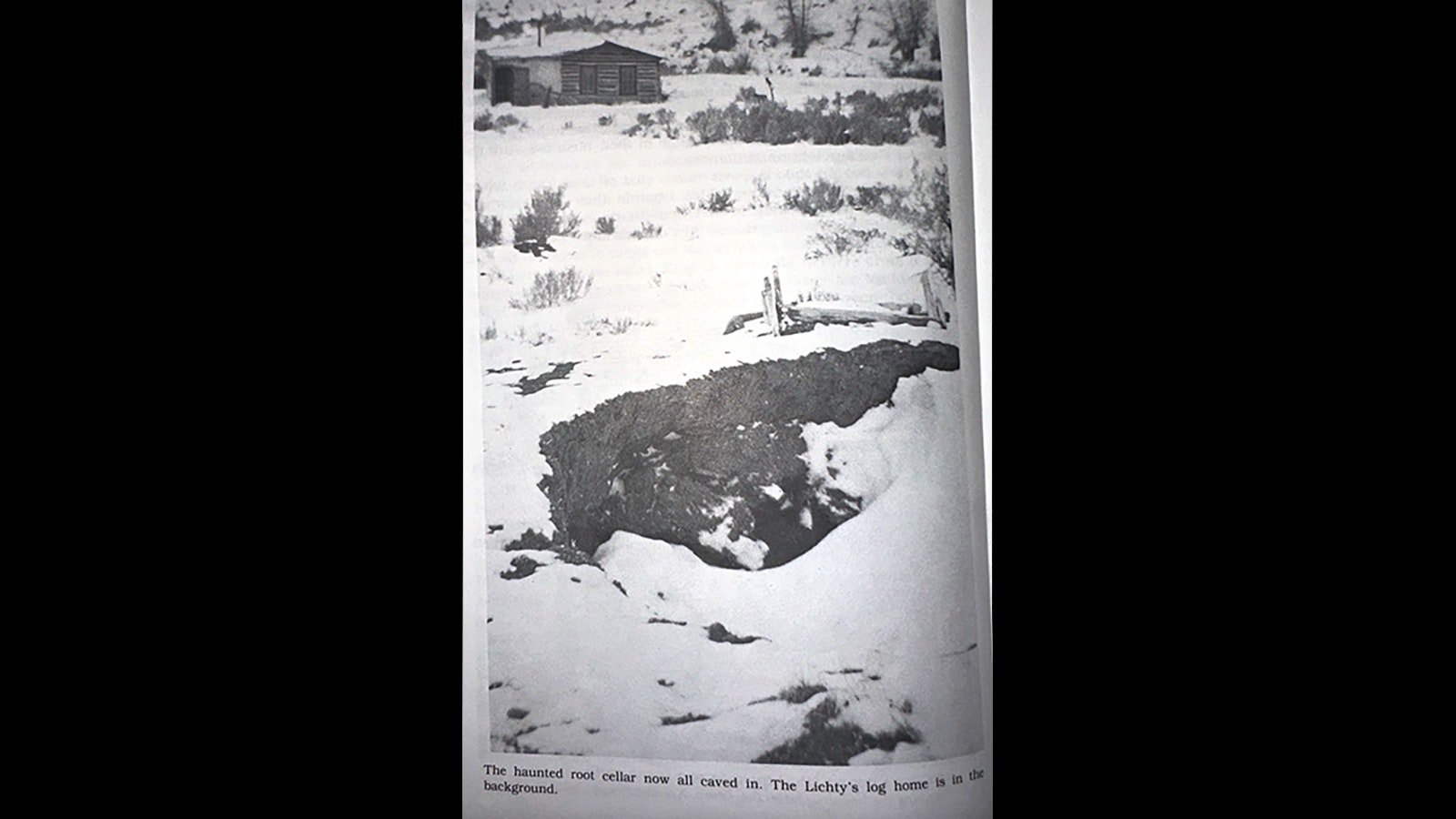 By the 1970s, the haunted cellar was caved in. The Lichty’s log cabin can be seen in the background.