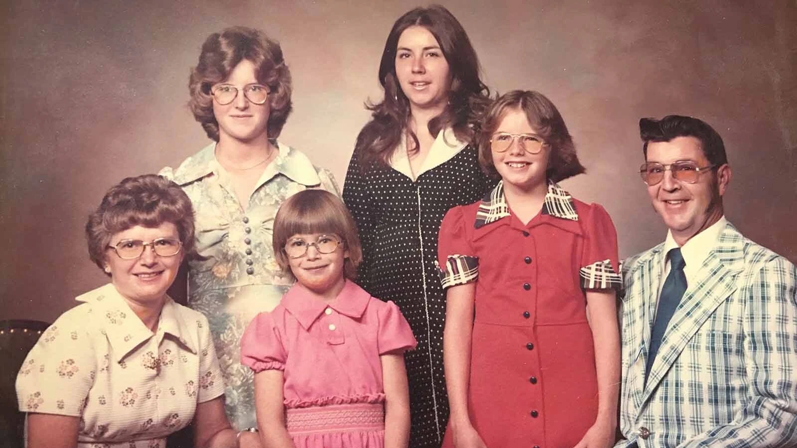 George and Arlene Long with their four daughters, Cindy, Kathy, Janet and Sandy, in a family portrait.