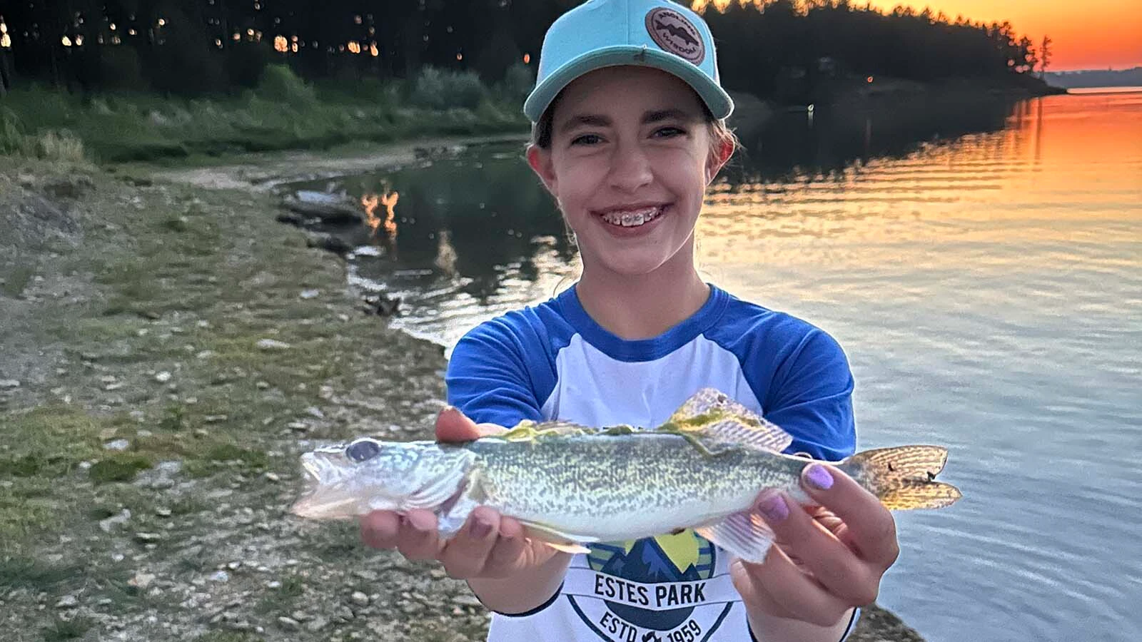 Faith Edwards of Fremont County poses with a walleye, one of Wyoming’s most popular game fish.