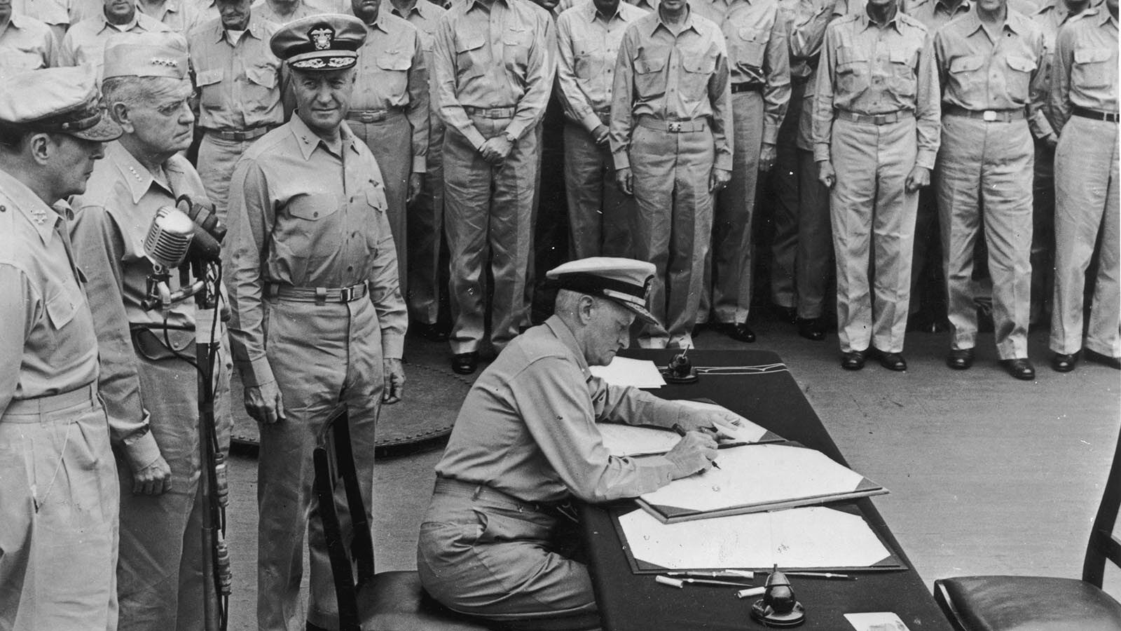 Admiral Chester Nimitz signs the “instrument of formal surrender” by the Japanese on the USS Missouri. He sent Walter Doyle a photo from the event with a personal message.