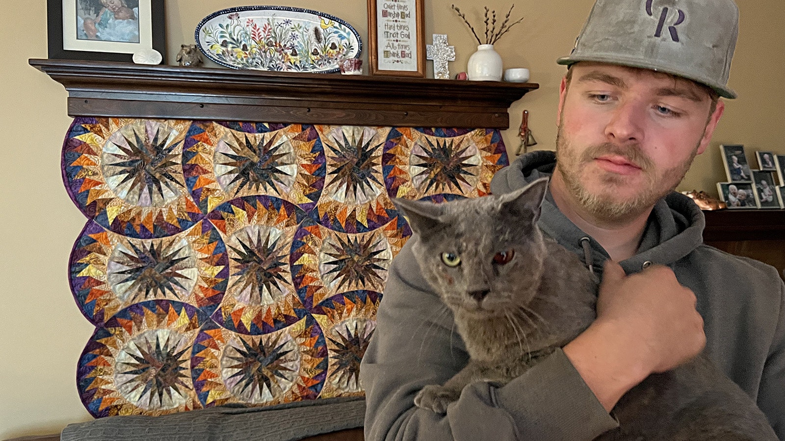 Jacob Lee of Cheyenne holds his cat Walter, which was tortured and shot 19 times with a pellet gun. The cat is recovering, but is blind in its left eye now and still has the pellets in him.