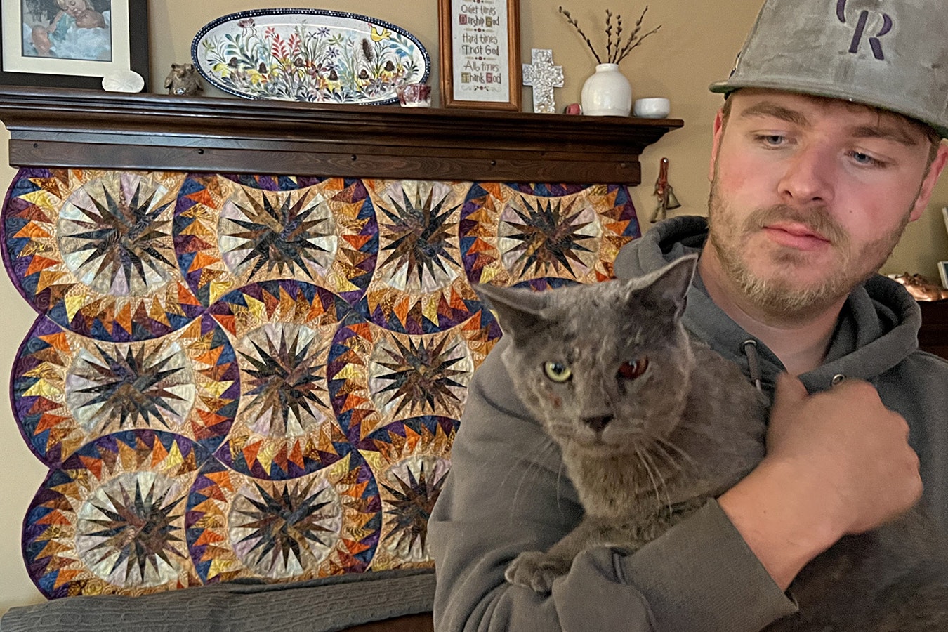Jacob Lee of Cheyenne holds his cat Walter, which was tortured and shot 19 times with a pellet gun. The cat is recovering, but is blind in its left eye now and still has the pellets in him.