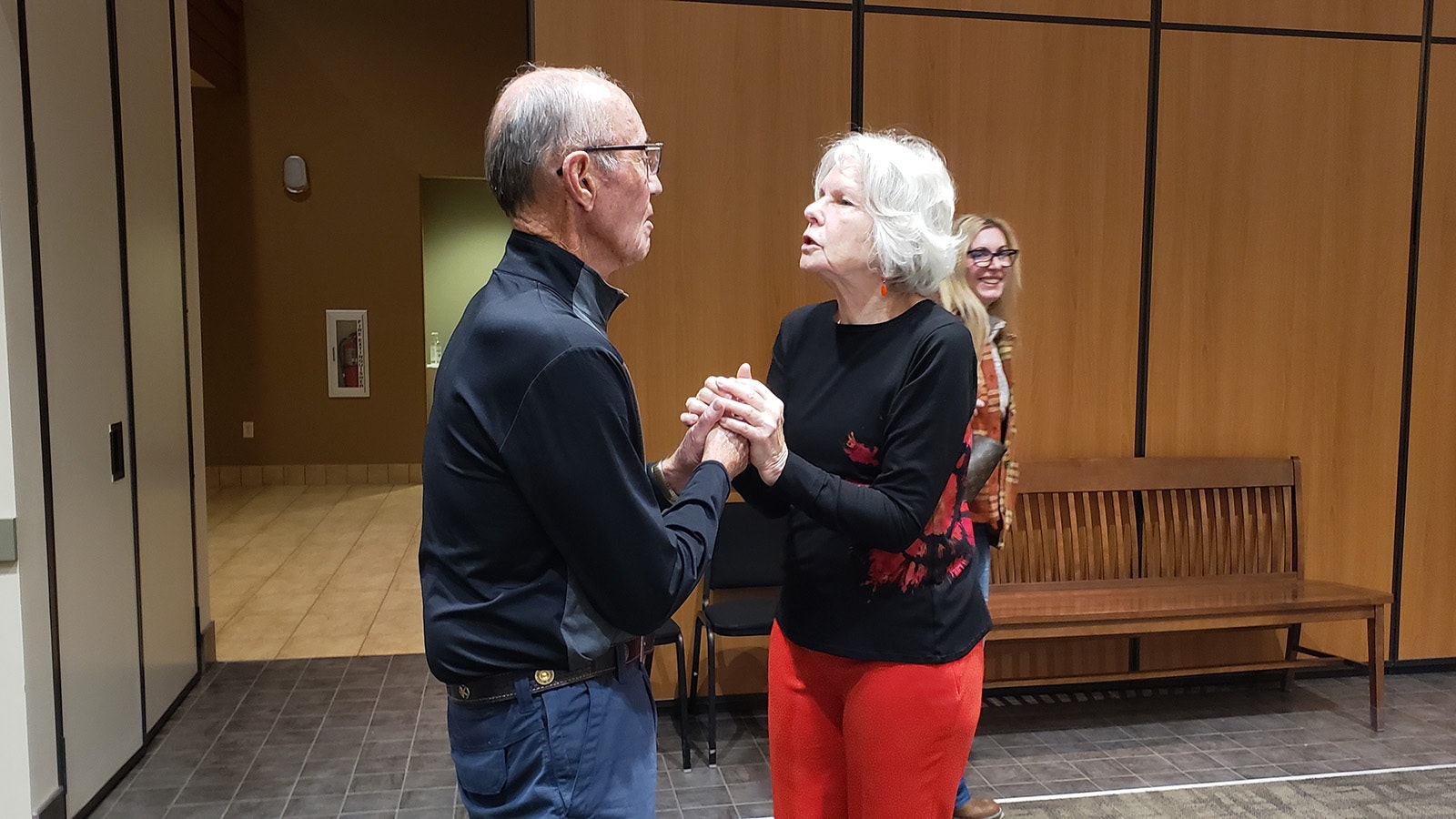 Cathy Healy talks with a classmate during a launch party for the War Babies of Worland, a collection of stories that tell the history of the children of the Greatest and Silent generations.