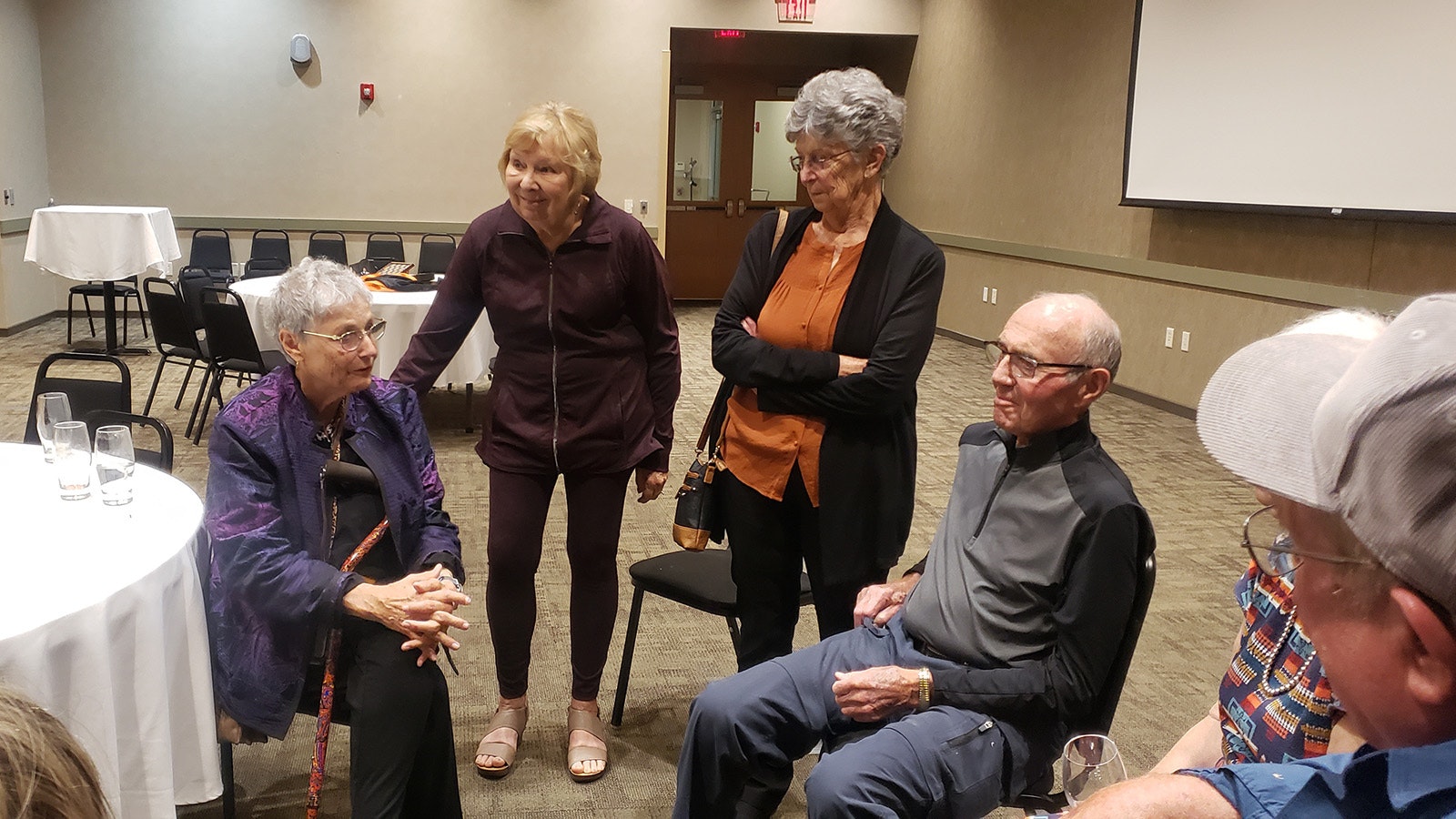 Members of the Worland High School Class of 1960 gather after the launch of the War Babies of Worland project.