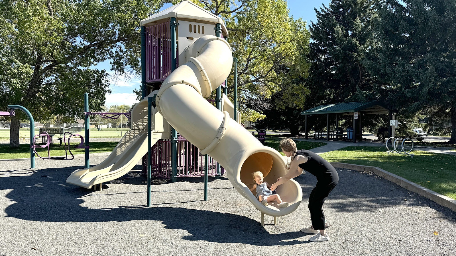 Wyoming's been enjoying a mild autumn with warm temperatures and a lack of snow and cold blasts. That may seem unusual, but it's average, something October hasn't been for several years in Wyomng. Here, a mother and child enjoy a warm October day in Cody in this file photo.