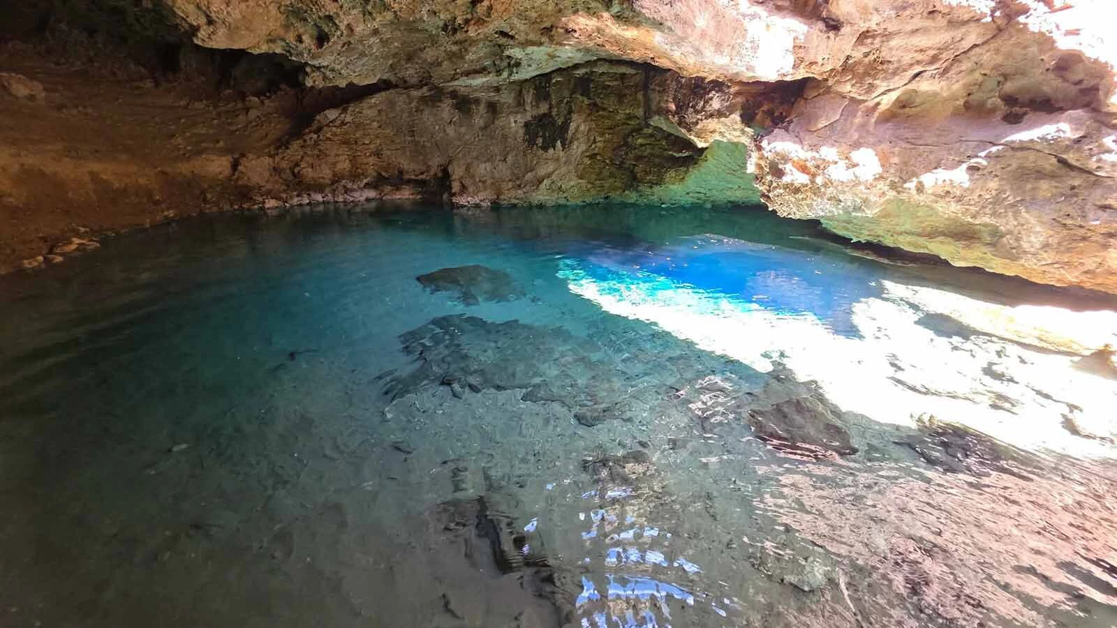 Warm Spring Geyser is a pool of brilliantly blue thermal water hidden in a cavern near Dubois, described by a frequent visitor as "like something you find down in the Caribbean.” The trick is getting there and whether to risk descending into it.