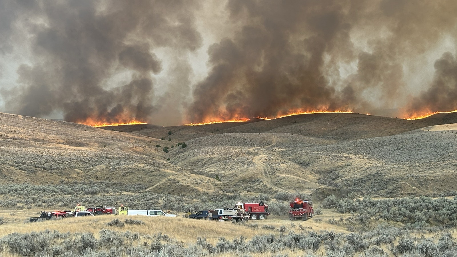 Firefighters continue to battle the Warm Springs Fire about 5 miles southeast of Thermopolis, Wyoming.