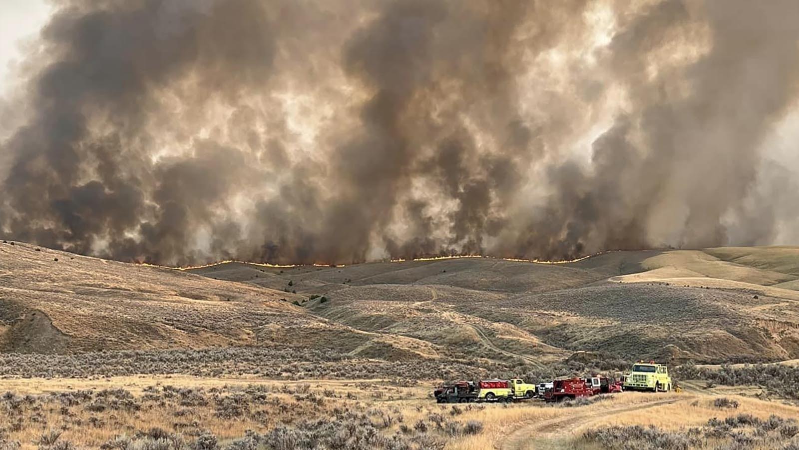 Fire crews are stationed near the fire line of the Warm Springs Fire.