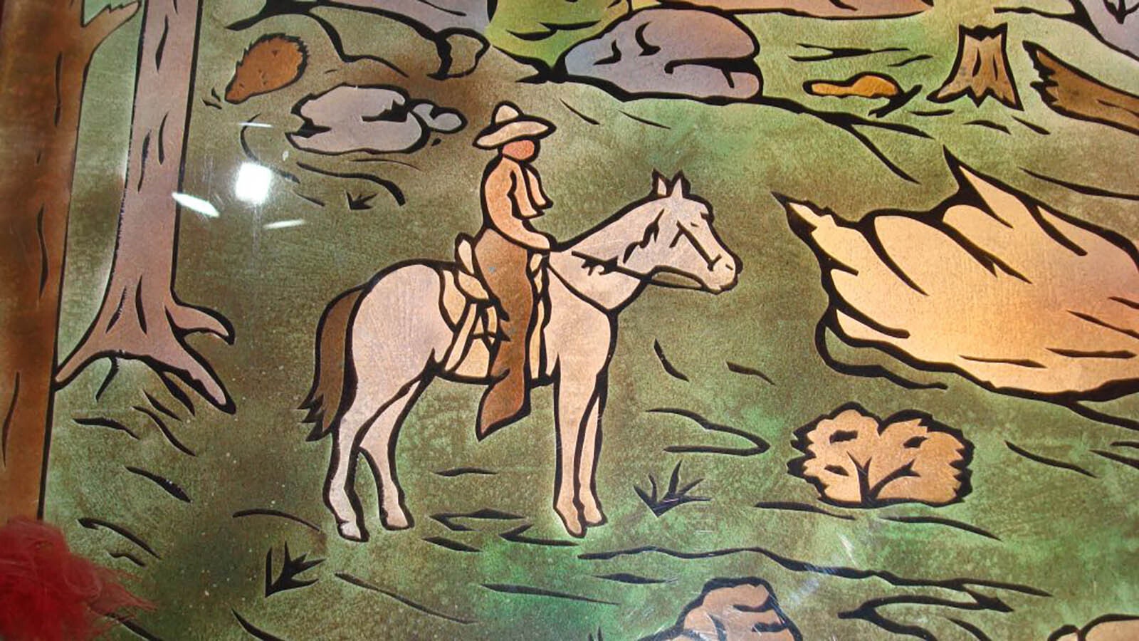 Warren “Bud” Wittstruck was an artist who specialized in creating designs for headstones and monuments. He designed this scene for the Governor’s Mansion and his son later had it transferred to plexiglass.