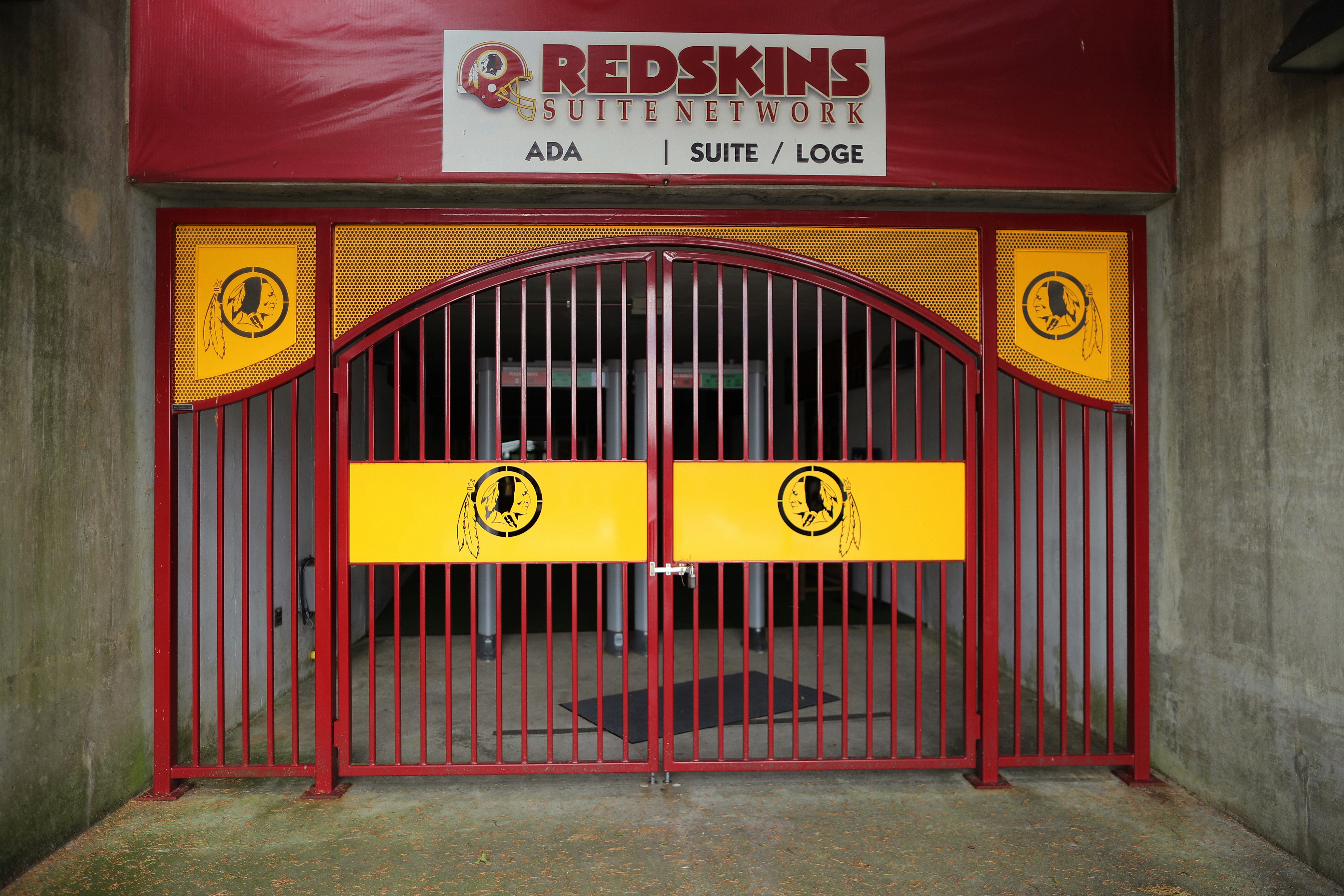 The NFL's Washington Redskin's logo is stamped in a steel gate at FedEx Field July 13, 2020, in Landover, Maryland.