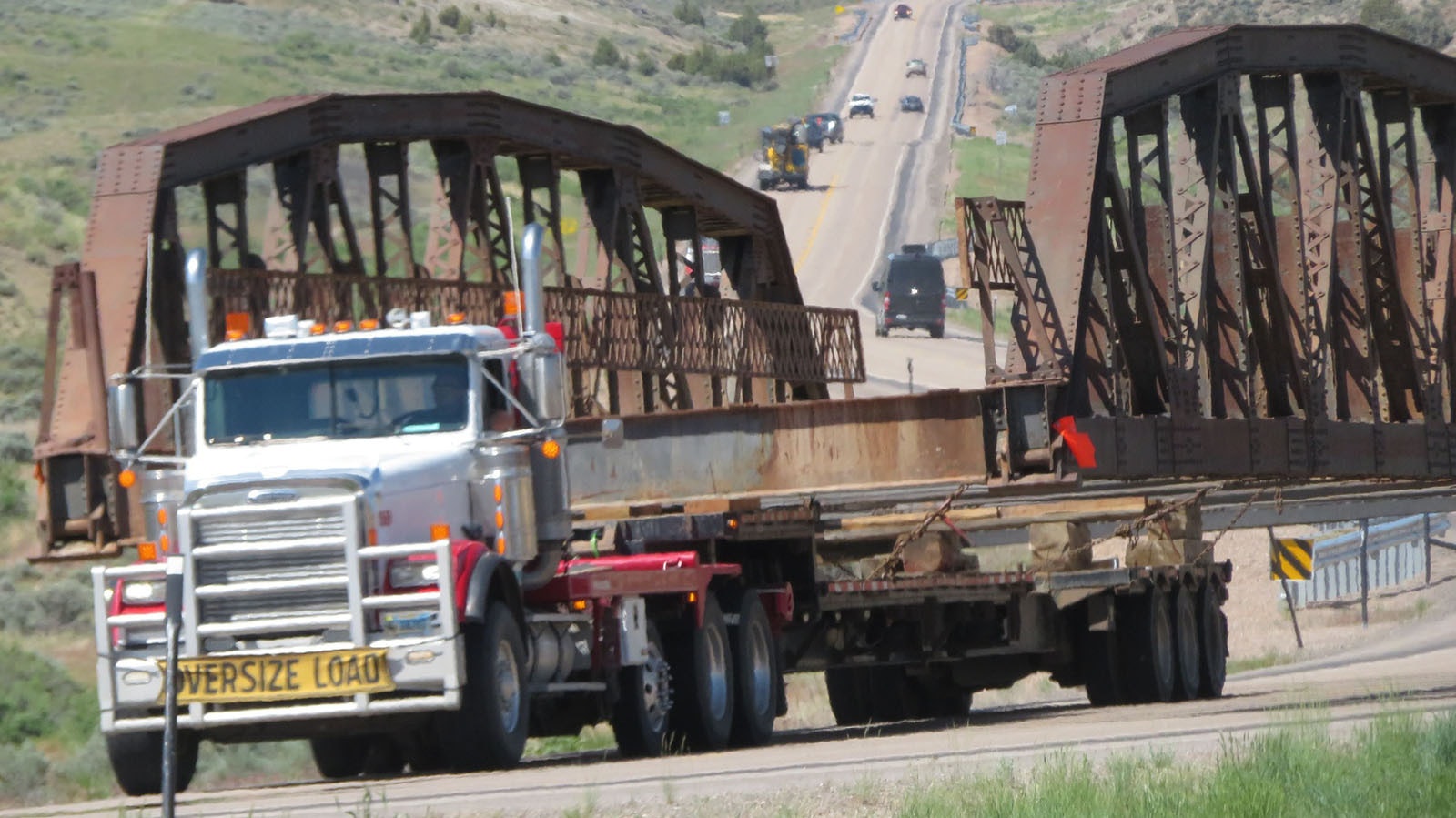 A large, 100-year-old bridge is moved in pieces along Washakie County roads this week.