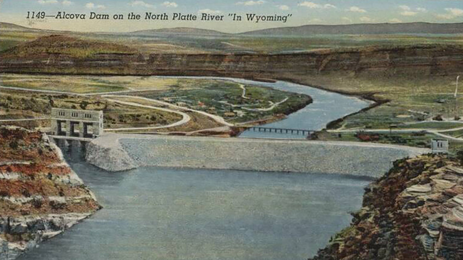 A postcard showing the Alcova Dam following its completion. The dam serves to help provide irrigation water to the Casper region.